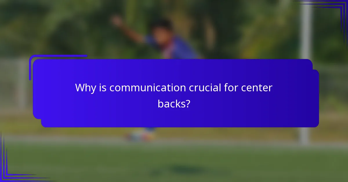Why is communication crucial for center backs?